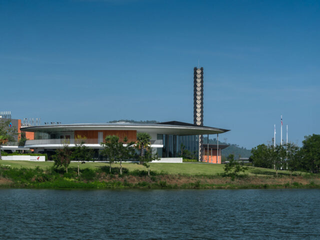 VISTEC Auditorium and lantern tower viewed across the campus lake
