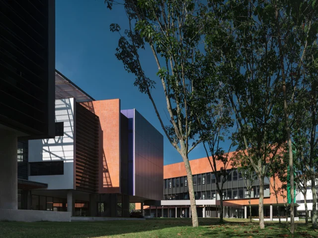 VISTEC academic building exterior with courtyard trees